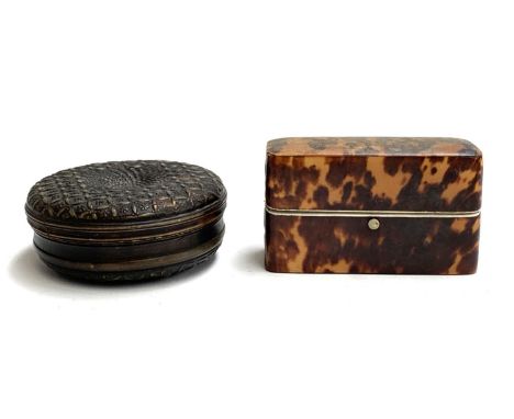A circular pressed horn snuff box, 10cm diameter; together with a tortoiseshell oblong box, hinge in as found condition, with