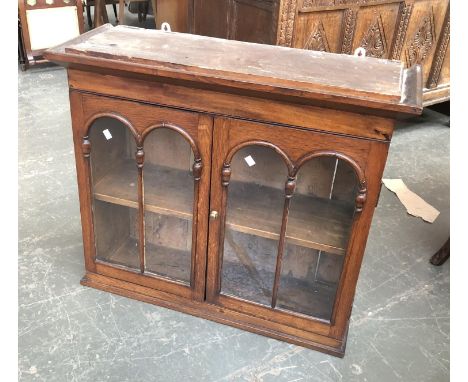 A 19th century glazed open cabinet, domed glazed doors opening to a single shelf, 84x31x71cmH 