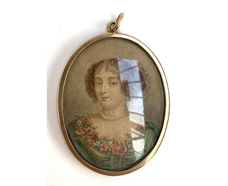 A 9ct gold photo locket containing a hand coloured print, the gold weight 15g, 6x4x5.2cm 