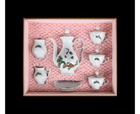 A cased 'tete-a-tete-a-tete' Korean porcelain tea service, mid 20th century, comprising a coffee pot and cover, sugar bowl, a