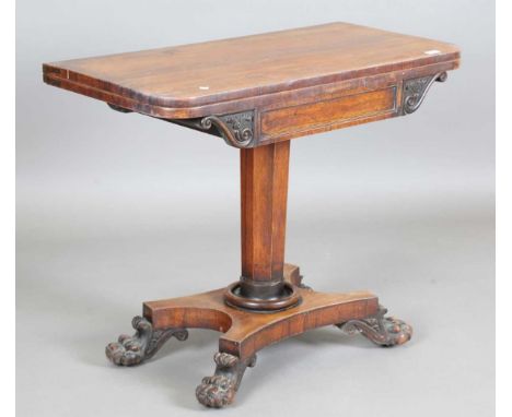 A Regency rosewood fold-over card table, raised on a quatrefoil base, height 73.5cm, width 92cm, depth 45.5cm.