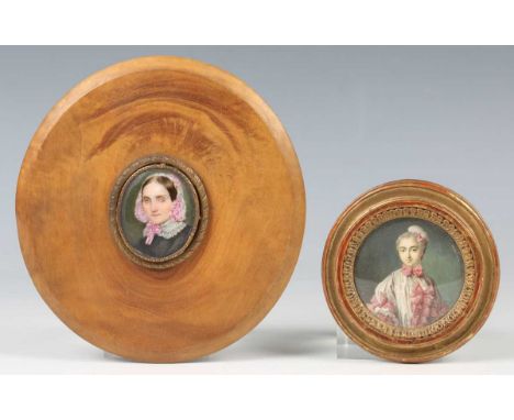 Continental School - a late 19th/early 20th century watercolour portrait miniature on ivory depicting a lady in a pink and wh