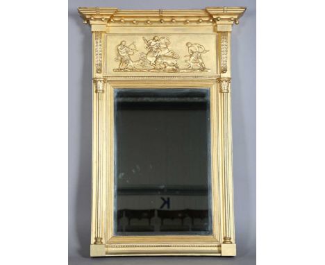 A Regency gilt composition pier mirror, the ball shot pediment above a boar-hunting scene and a bevelled glass, height 112cm,
