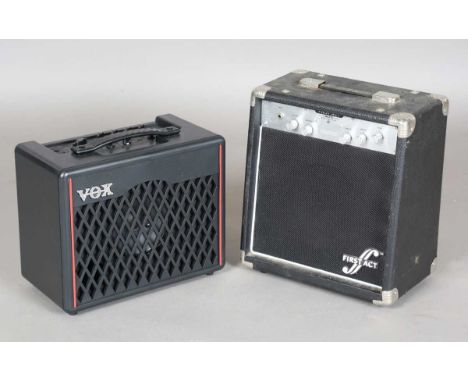 A First Act MA215 bass amplifier, width 33cm, and a Vox VX-1 modelling guitar amplifier.