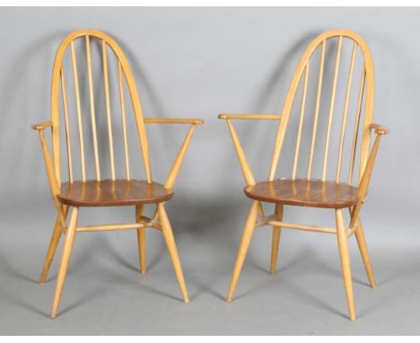 A pair of Ercol stick and hoop back Windsor armchairs, height 96cm, width 62cm.