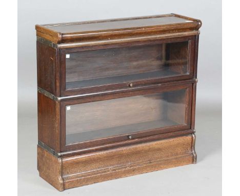 A George V oak Globe Wernicke two-section bookcase, on a plinth base, height 82cm, width 86cm, depth 27cm.