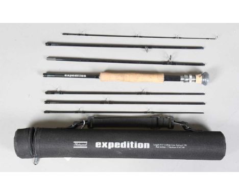 A group of seven fishing rods, including a Shakespeare Expedition 9' 6" seven-piece fly fishing rod, with cloth case and tube