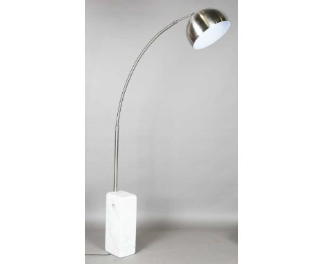 A modern 'Arco' floor lamp, originally designed by the Castiglioni brothers in 1962, the arched stem and shade on a white mar