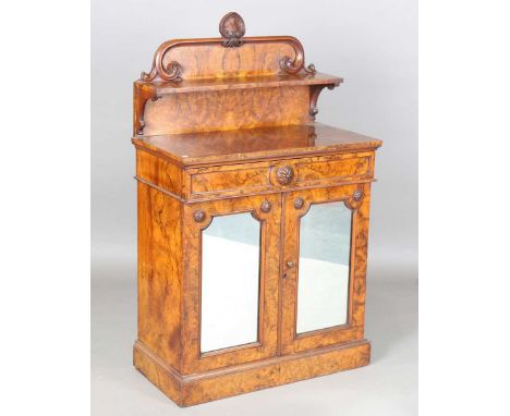 A Victorian burr walnut chiffonier, the shelf back above a drawer and a pair of mirrored doors, on a plinth base, height 131c