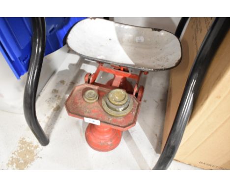 A set of vintage kitchen balance scales and weight set