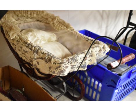 A vintage childrens toy pram