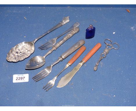 A small quantity of cutlery including nickel berry spoon, plated sugar tongs, ornate handled spoon, pastry fork with emblem '