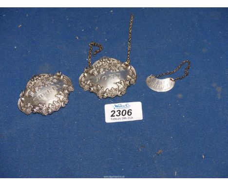 Three Silver decanter Labels including; a pair for Sherry and Port, plus a smaller one for Whisky - hallmarks for London and 