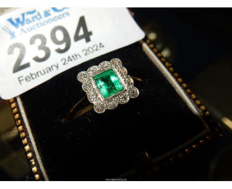 An 18ct all gold Emerald and Diamond ring with princess cut emerald surrounded by 12 small diamonds, size N