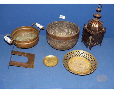 A quantity of metals including a Moorish style copper light holder, bowl with reticulated dash design, ceramic handled footed