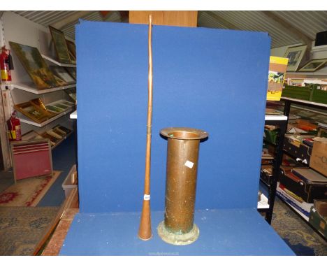 A Copper horn, 37 1/4" long and a Lawrence Butler Cornish copper ware Stick Stand, 19 1/2" tall.