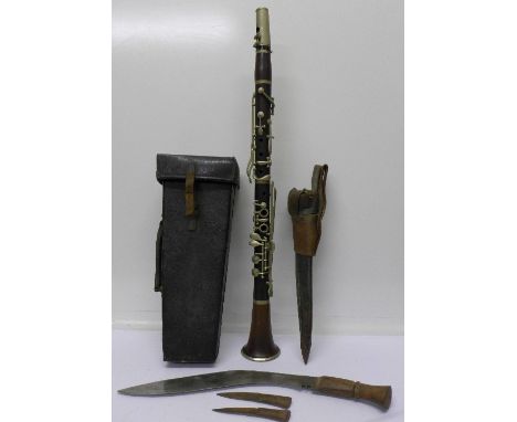 A cased wooden clarinet, Rudall, Carte & Co. Ltd., and a kukri knife