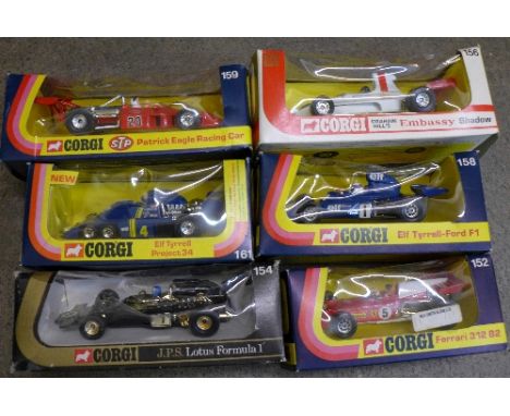 Six Corgi die-cast racing cars, boxed