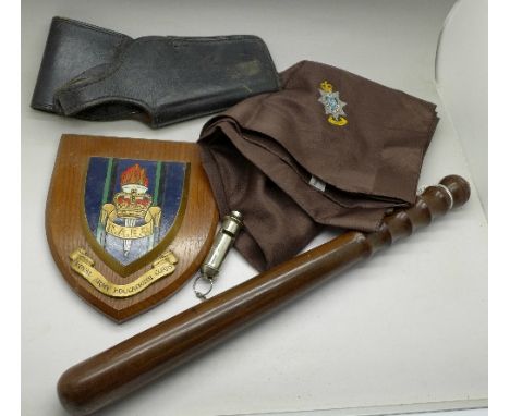 A police truncheon, whistle, a Police Staff College scarf and a leather holster