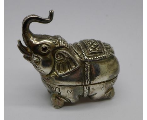 A novelty white metal elephant trinket box with garnet eyes, marked Cambodge and 925