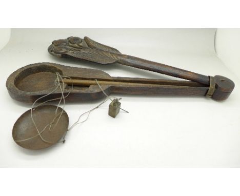 A set of late 19th Century opium scales in a carved case