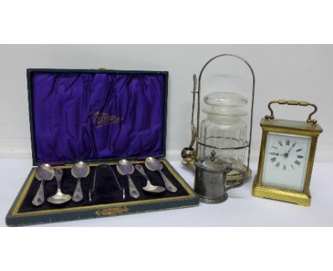 A carriage clock, a pickle jar, a case of plated spoons and sugar bows and a mustard