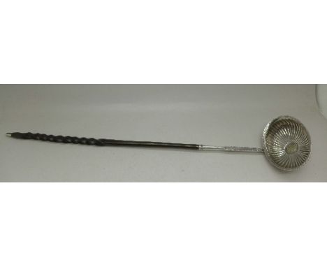A 19th Century toddy ladle with whalebone handle