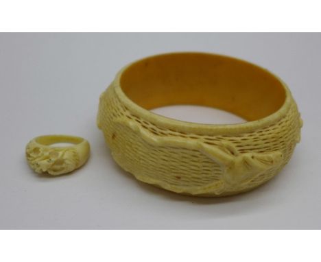 A carved ivory bangle and ring