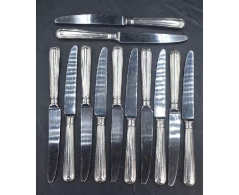 A set of twelve Elizabeth II silver handled knives, having a moulded step design, marks for Sheffield 2001, maker Terry Shave