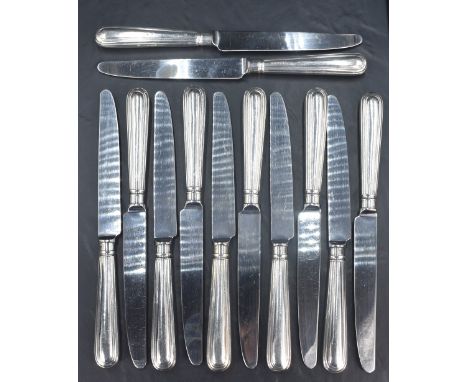 A set of twelve Elizabeth II silver handled table knives, having unmarked blades and a moulded step design, marks for Sheffie