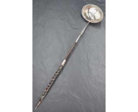 A George III silver and Baleen toddy ladle of traditional form with beaded rim and bright cut engraving, with interesting twi