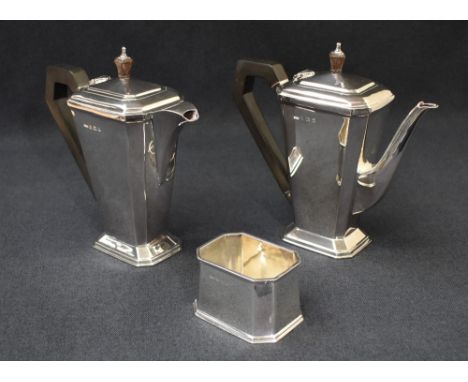 An Art Deco silver harlequin coffee set, comprising a coffee pot, hot water pot and sugar, having tapered geometric canted re