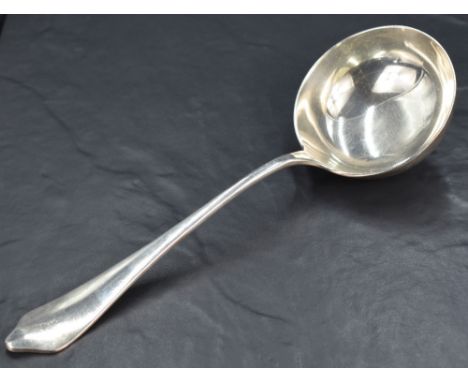 An Edwardian silver trefoil pattern ladle, with rat-tail reverse, marks for Sheffield 1911, maker Thomas Bradbury &amp; Sons 