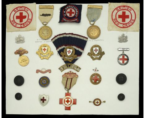 A mounted display of British Red Cross Society medals and badges, comprising British Red Cross Society Medal for War Service 