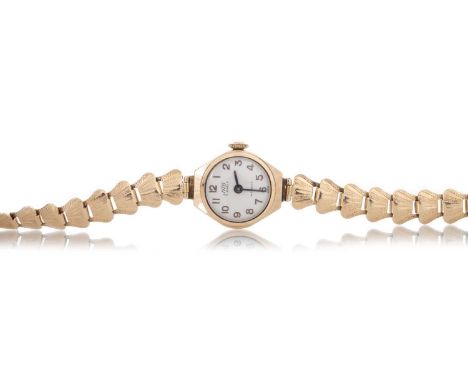 UNO NINE CARAT GOLD MANUAL WIND WRIST WATCH the round cream dial with Arabic hour markers, 16mm case, on a fan bracelet hallm