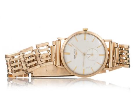 LONGINES GOLD CASED MANUAL WIND WRIST WATCH the round cream dial with baton hour markers, subsidiary dial at 6, 32mm case, on