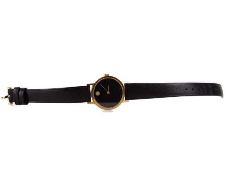 MOVADO ZENITH GOLD PLATED STAINLESS STEEL QUARTZ WRIST WATCH the round black dial lacking hour markers, 24mm case, on a black