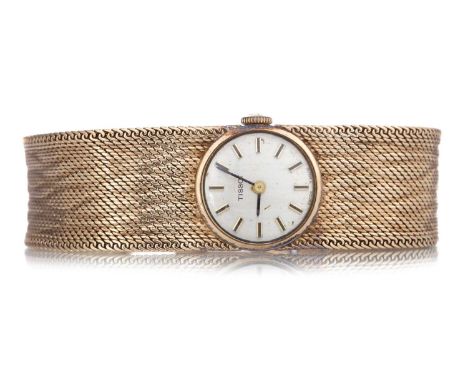 TISSOT NINE CARAT GOLD MANUAL WIND WRIST WATCH the round dial with baton hour markers, 17mm case, on a nine carat gold bracel
