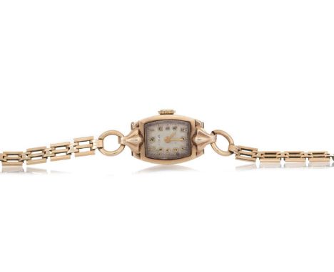 LADY'S WRIST WATCH NINE CARAT GOLD CASED MANUAL WIND the rectangular cream dial with Arabic hour markers, 14mm case, on a rol