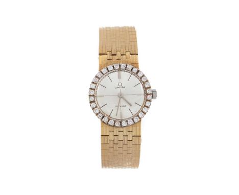 OMEGA DE VILLE  DIAMOND SET EIGHTEEN CARAT GOLD MANUAL WIND WRIST WATCH the round dial with baton hour markers, 21mm case wit