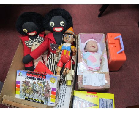 A Carved Wooden Puppet 'Pinochio', two golly's, newborn doll, children's microscope, etc:- One Box.