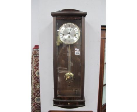 A.M.S (Germany) Walnut Cased Wall Clock, with a silver dial, Roman numerals, bevelled glass door, with a small drawer, 70cm h