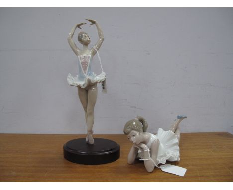 A Lladro Figure of a Ballerina, on a plinth boxed, 31cm high, together with a Nao figure of a ballerina laying down cross leg