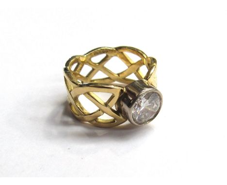 An 18ct gold celtic design knotted ring set with 1.50ct diamond approx