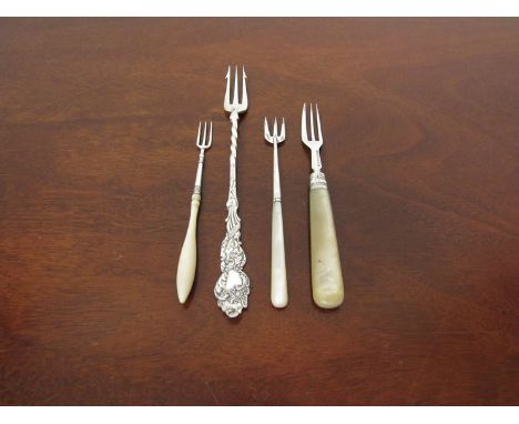 A Victorian and Edwardian silver ended pickle fork with mother of pearl handles and two plated pickle forks (4)