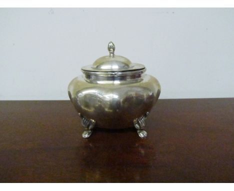 A miniature silver tea caddy of melon form raised on paw feet, lid surmounted with flame finial 9cm tall marks rubbed, 140g  