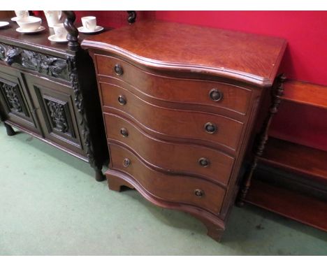 A 'Shaw of London' bachelor's chest, serpentine front, ring handles, bracket feet 