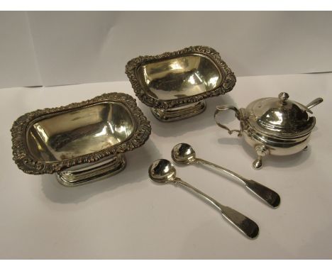 A silver mustard pot on tripod feet with spoon marked Birmingham and a pair of silver plated on copper bowls with silver spoo