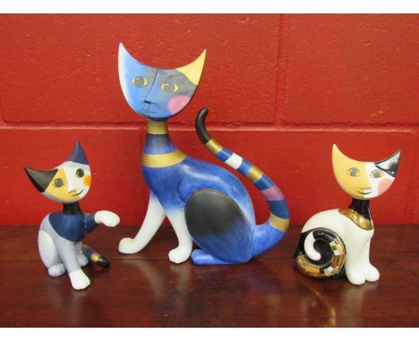 Three large Goebel cats, one restored