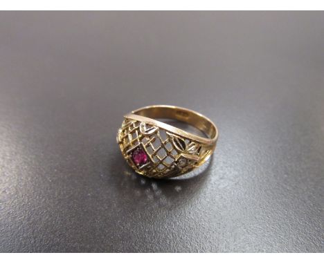 A 9ct gold basket weave ring with central ruby 